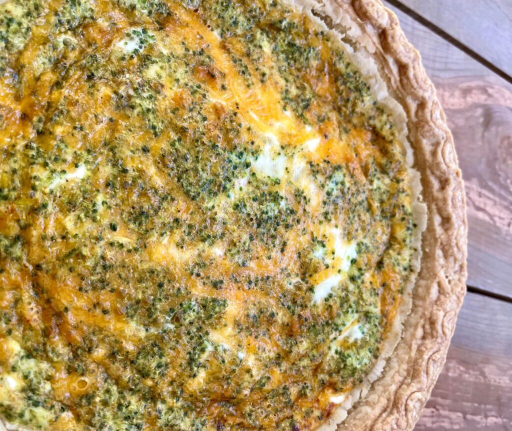 close up of broccoli cheddar quiche
