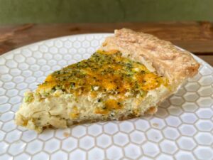 slice of quiche on plate